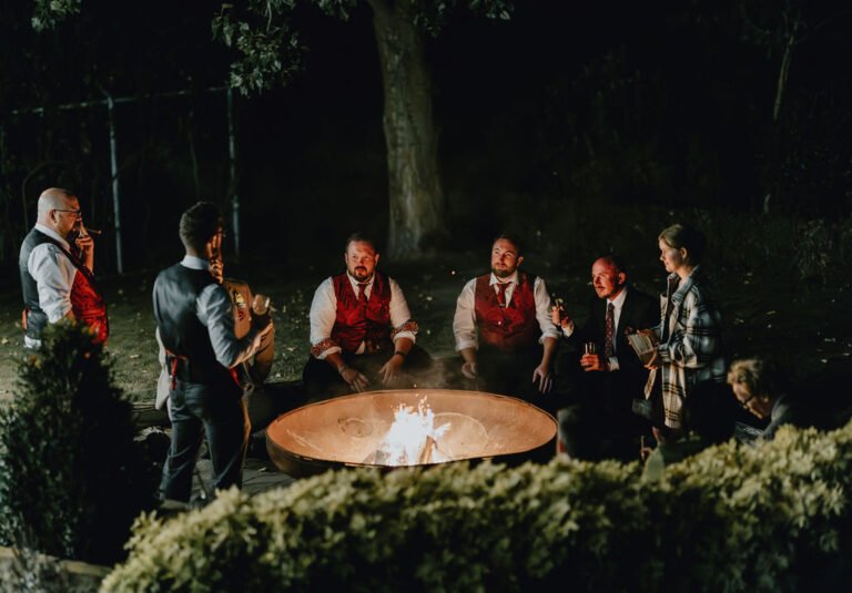 Wedding guests around a firepit