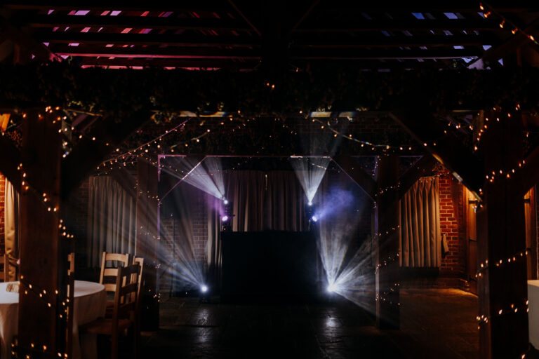 The Hop Barn at The Ferry House wedding venue in Kent set up for an evening reception.