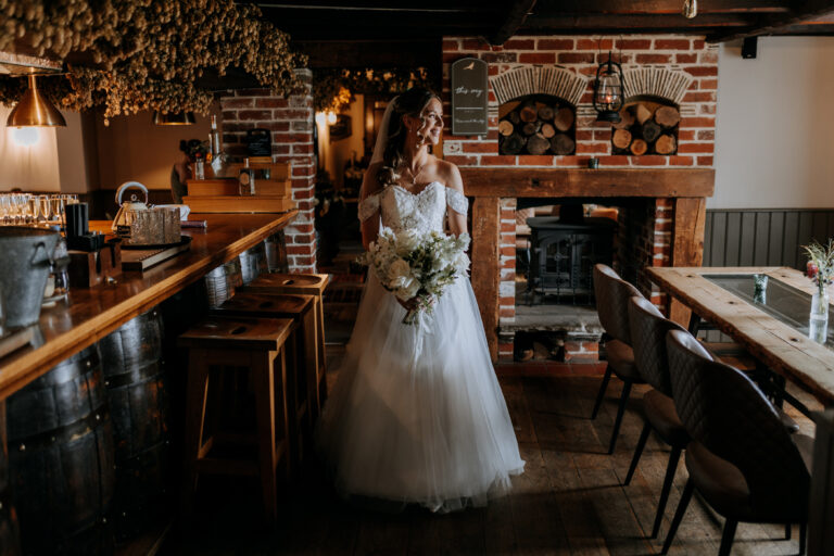 A bride walking through the pub at The Ferry House wedding venue in Kent.