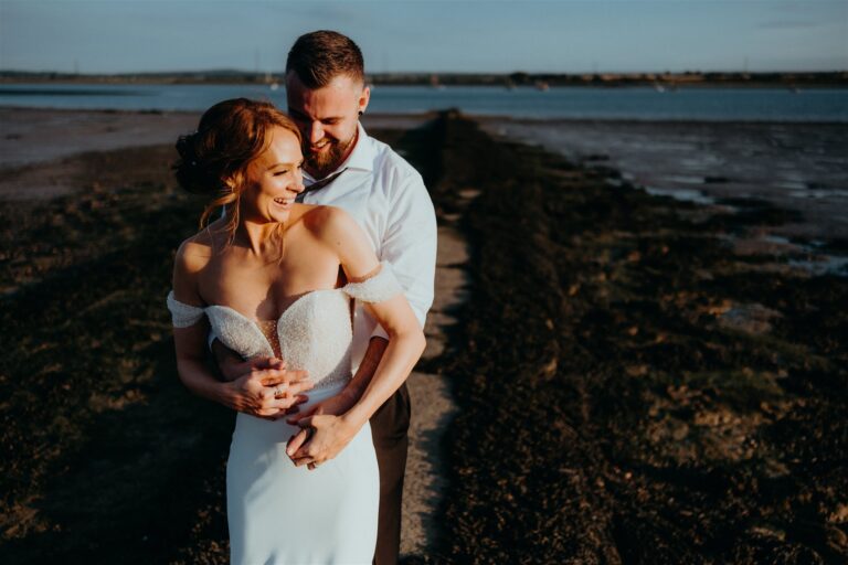 A wedding couple beside the Swale estuary