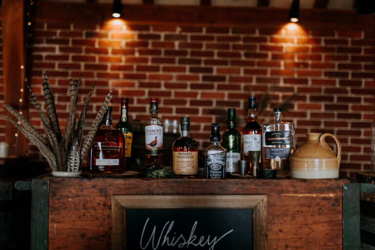 A whisky bar set up for a wedding in the Hop Barn at Kent wedding venue The Ferry House.
