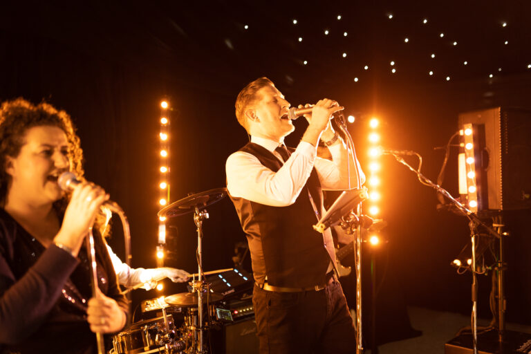 The Redfords band performing at a party.