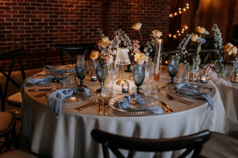 A caterpillar table set up in the Hop Barn at The Ferry House for a spring wedding with a colour blocking theme.